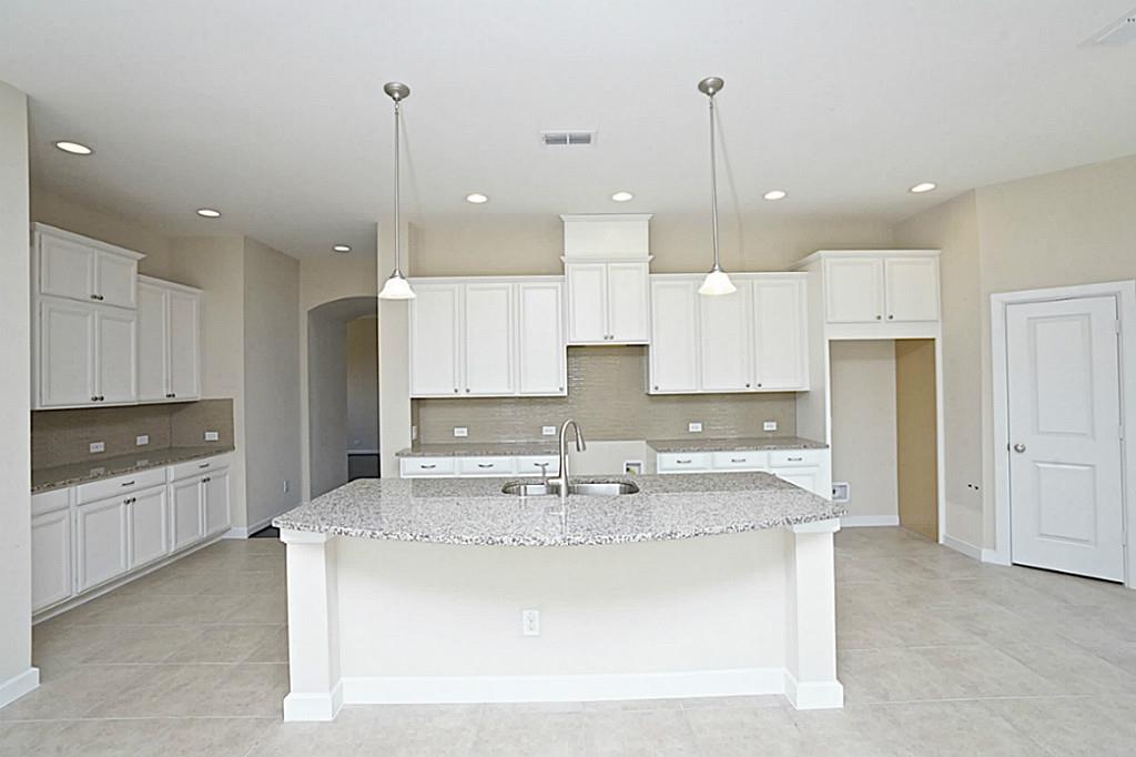 Kitchen by David Weekly Homes at Miramesa